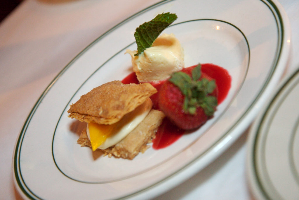 A dessert plate with a fancy dessert.