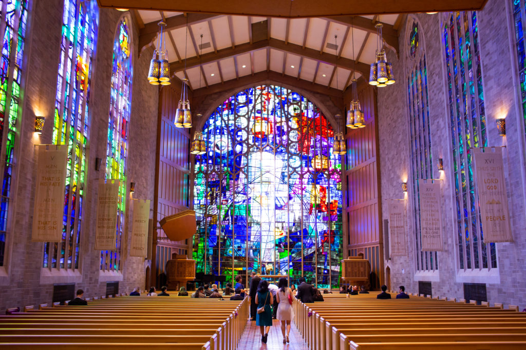 A large stained-glass window in a chapel. 