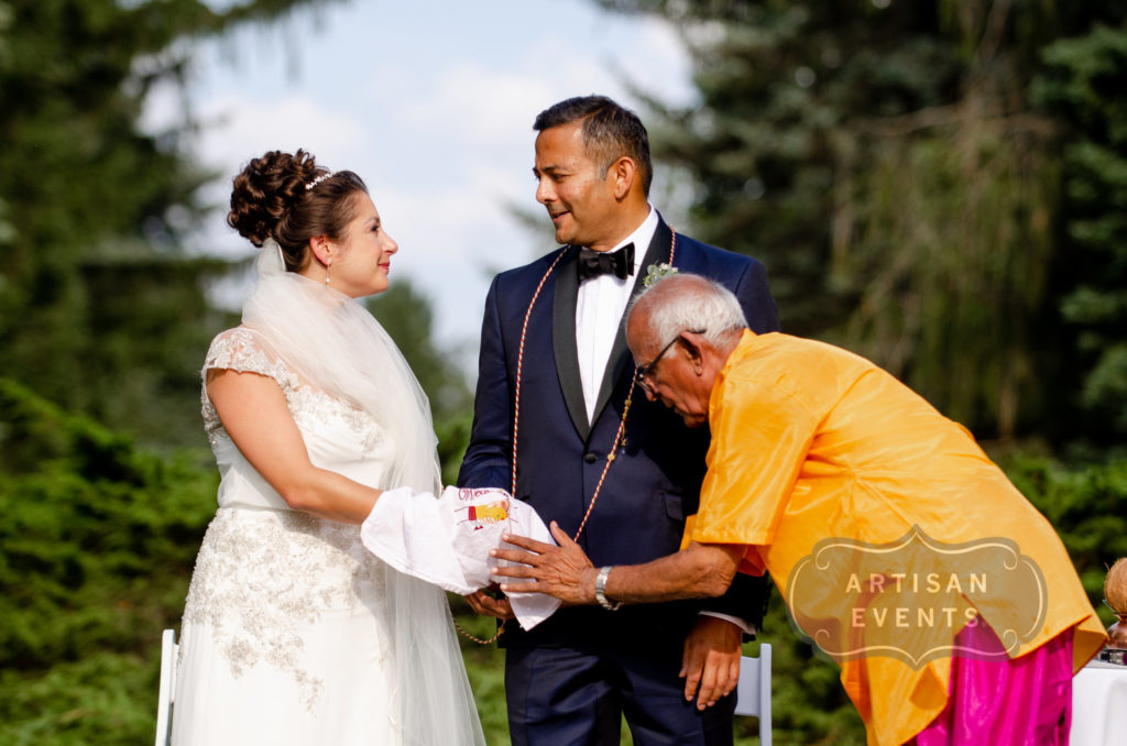 A wedding couple with a Hindu priest--and no one else.